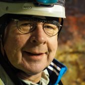 Don Johnston smiles at the camera wearing a helmet.