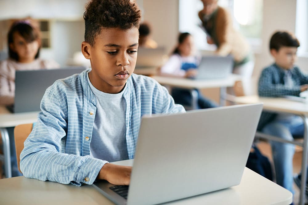 student-using-laptop-classroom